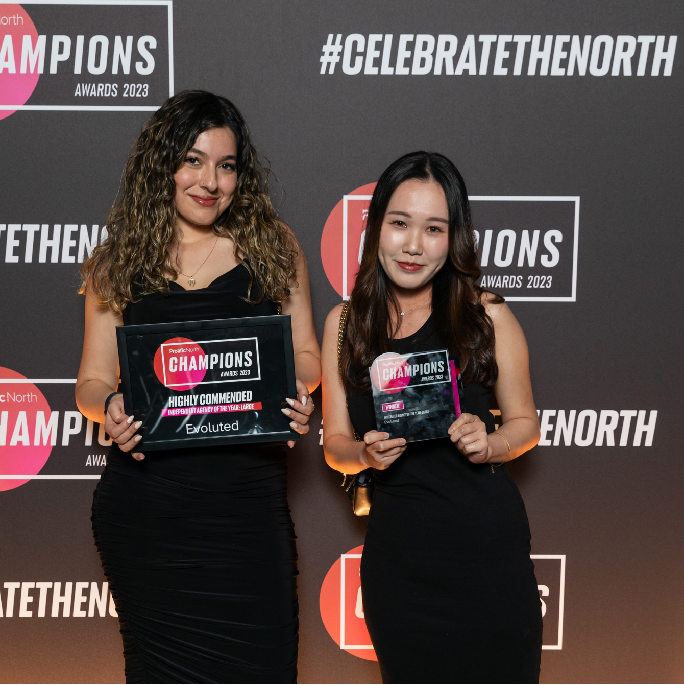 Evoluted's Amber Mukerker and Joyce Lee with Prolific North Champions Awards trophies