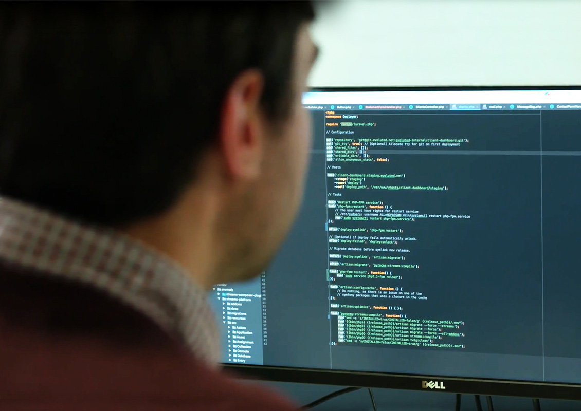 developer looking at desktop screen of code